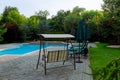 clean swimming pool and empty resting chair