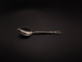 Clean teaspoon on a dark background. Object shooting