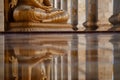 clean temple floor reflecting the image of a serene buddha statue