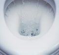 Clean toilet flushing Royalty Free Stock Photo