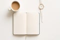 Open Notebook, Coffee, and Watch on White Surface - Planning Time Conceptual background Royalty Free Stock Photo