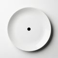 Minimalist White Plate with Single Black Dot Royalty Free Stock Photo