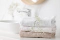 Clean towels and flowers on counter Royalty Free Stock Photo