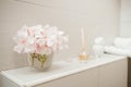 Clean towels, flowers and Spa bath cosmetic on bathroom Royalty Free Stock Photo