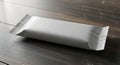 Blank White Snack Bar or Candy Wrapper Mockup on Dark Wood Royalty Free Stock Photo