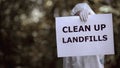 Clean up landfills sign biochemist hands, plastic waste pollution, environment