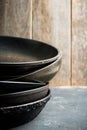 Clean vintage frying pans on the rustic background