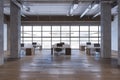 Clean warehouse office interior with window and city view, furniture, wooden flooring and columns. Royalty Free Stock Photo