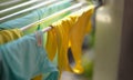 Clean washed clothes are dried in metal dryer closeup