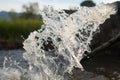 Clean water flowing out from public irrigation pipe Royalty Free Stock Photo