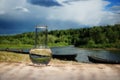 Clean water in a glass laboratory flask on wooden table on mountain river background. Ecological concept, the test of Royalty Free Stock Photo