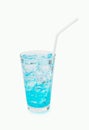 Clean water light blue nectar sweet in a glass with ice drinking with a straw isolated on white background. Royalty Free Stock Photo