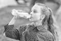 Clean water is a vital resource for human existence. Little girl having a drop of water. Thirsty child drinking fresh Royalty Free Stock Photo