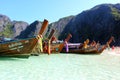 Clean water and white sand on Thailand beach with long tail boat