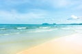 Clean white beach golden brown sand and small wave from blue sea under clear blue sky in a sunny day Royalty Free Stock Photo