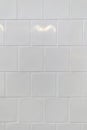 Clean white ceramic subway tiles arranged in a horizontal brick pattern Royalty Free Stock Photo