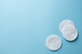 Clean white cotton stack of disk for beauty face hygiene with selective focus on blue neutral background. Cosmetic softness pure Royalty Free Stock Photo