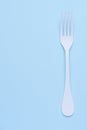 Clean white fork on trendy blue pastel background
