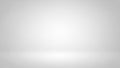 Clean white and grey studio background with soft spotlight and subtle floor gradient Keywords: studio, background Royalty Free Stock Photo