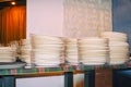 Clean white plates stacked on table Royalty Free Stock Photo