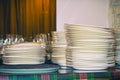 Clean white plates stacked on table Royalty Free Stock Photo