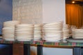 Clean white plates stacked on table Royalty Free Stock Photo