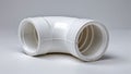 PVC elbow pipe clean and unprinted, resting on side, white surface background Royalty Free Stock Photo