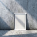 Blank White Frame Mockup on Textured Concrete Wall with Sunlight Shadows Royalty Free Stock Photo