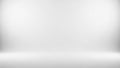 Clean white studio background with soft diffused spotlight illumination creating a subtle gradient effect and empty Royalty Free Stock Photo