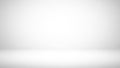 Clean white studio background with a subtle grey gradient and soft shadow effect creating a neutral empty space for product Royalty Free Stock Photo