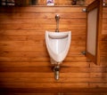 White Porcelain, Urinal in teak wall