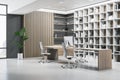 Clean wooden and concrete library office interior with furniture and decorative plant.