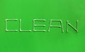 Clean is the word made up with cotton swabs on green background