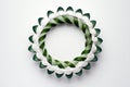 A single geometric wreath made of interlocking green circles, centered on a white background