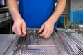 Some Cleaned surgical instruments are sorted into an instrument tray