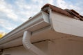 Cleaned white new gutters and drain pipes on restoration house