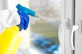 Cleaner disinfecting window handles Royalty Free Stock Photo