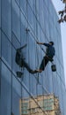 Cleaner cleaning glass wall in chengdu,china