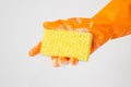 Cleaner concept, Hand in orange rubber gloves and holding yellow sponge with foam for cleaning Royalty Free Stock Photo