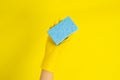 Cleaner concept, Hand in rubber gloves and holding light blue sponge for cleaning in home Royalty Free Stock Photo