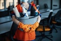 Cleaner in a face mask showing her cleaning products Royalty Free Stock Photo