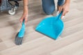 Cleaner Sweeping Floor With Broom And Dustpan In Office Royalty Free Stock Photo