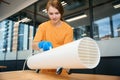 Cleaner uses an ozone generator in a coworking space Royalty Free Stock Photo