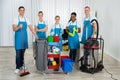 Cleaners With Cleaning Equipments In Office Royalty Free Stock Photo