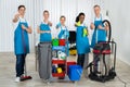 Cleaners With Cleaning Equipments In Office Royalty Free Stock Photo