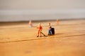 Cleaners cleaning wooden floor B Royalty Free Stock Photo