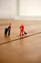 Cleaners cleaning wooden floor C Royalty Free Stock Photo