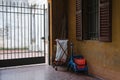 Cleaners trolley with cleaning equipments in the italian courtyard Royalty Free Stock Photo