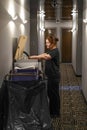 Cleaners trolley and housekeeper at hotel Royalty Free Stock Photo