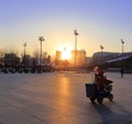 Cleaners work at beijing olympic sports center plaza at sunrise, adobe rgb